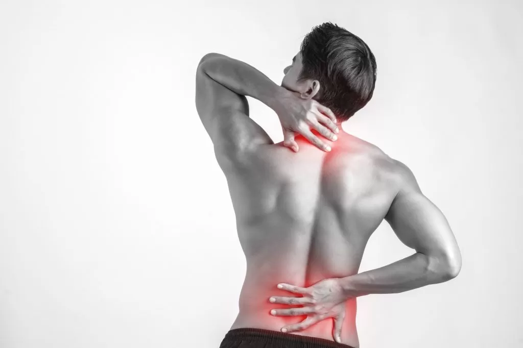 close up man rubbing his painful back isolated white background